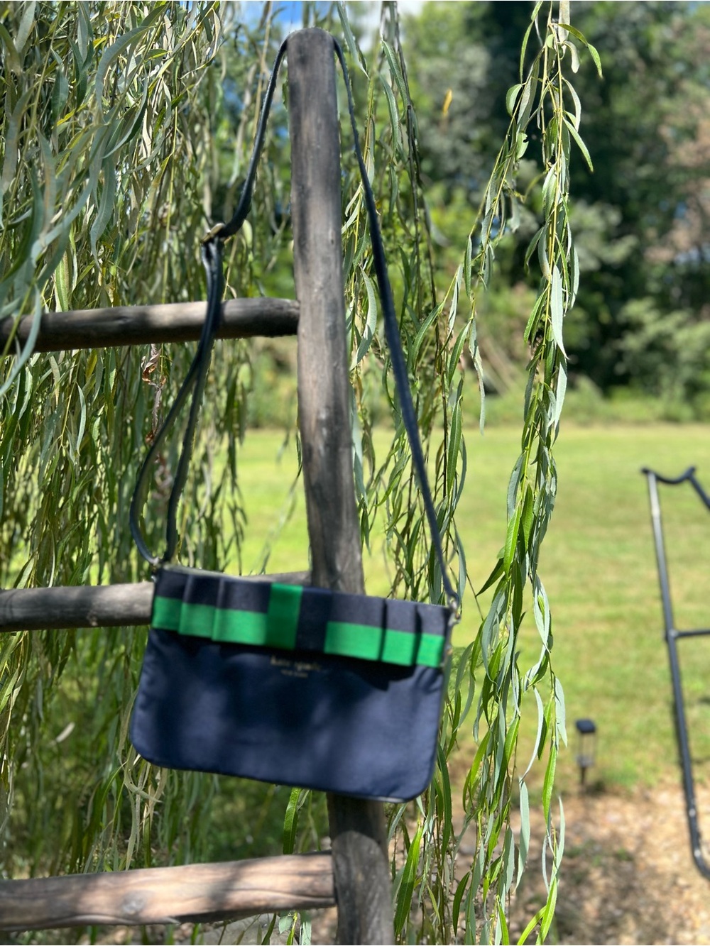 kate spade navy messenger bag with green trim